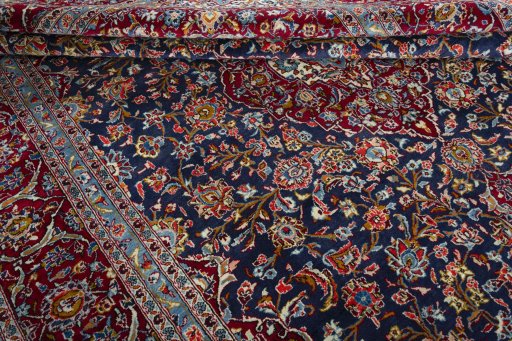 Close-up detail of 2000s Kashan rug from Iran / Persia showing Wool weave