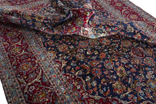 Surface texture of 2000s Kashan rug with natural Wool and intricate pattern