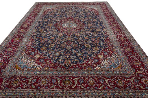 Surface texture of 2000s Kashan rug with natural Wool and intricate pattern