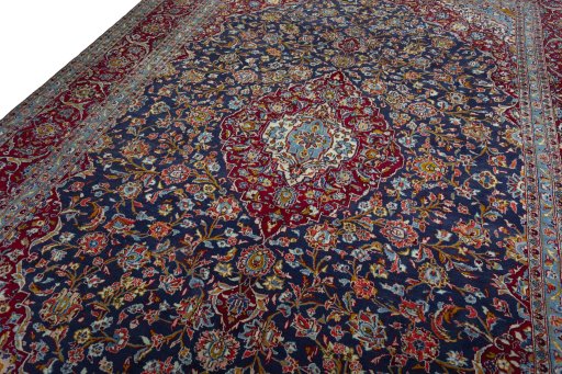 Backside of handmade 2000s Kashan rug showing knot structure and weave density