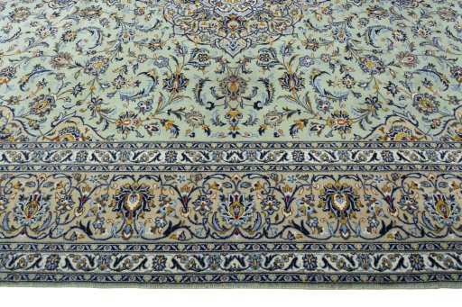 Corner detail of 2000s Kashan rug showing border pattern and Wool pile