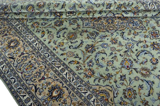 Close-up detail of 2000s Kashan rug from Iran / Persia showing Wool weave