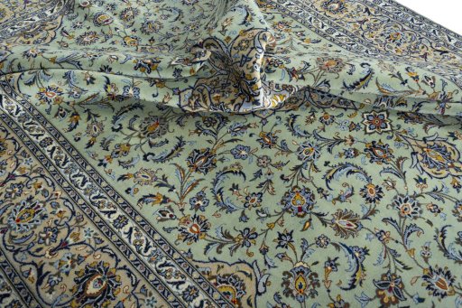 Surface texture of 2000s Kashan rug with natural Wool and intricate pattern