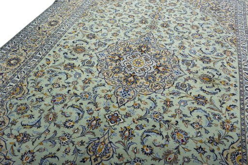 Backside of handmade 2000s Kashan rug showing knot structure and weave density