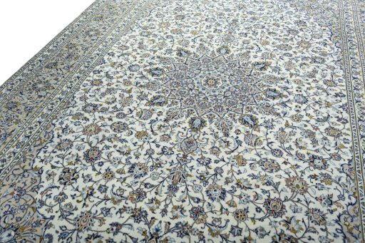 Backside of handmade 2000s Kashan rug showing knot structure and weave density