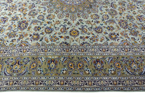 Corner detail of 2000s Kashan rug showing border pattern and Wool pile