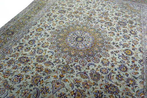 Backside of handmade 2000s Kashan rug showing knot structure and weave density