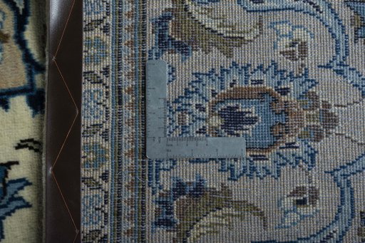 Backside of handmade 2000s Kashan rug showing knot structure and weave density