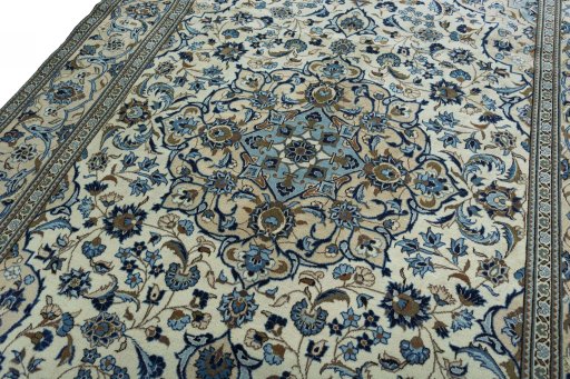 Backside of handmade 2000s Kashan rug showing knot structure and weave density