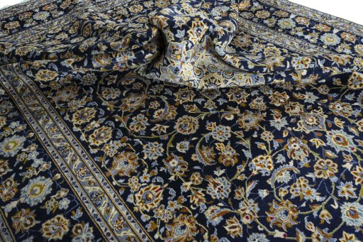 Surface texture of 2000s Kashan rug with natural Wool and intricate pattern