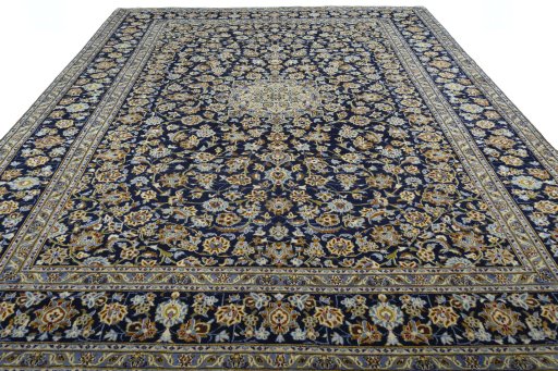 Surface texture of 2000s Kashan rug with natural Wool and intricate pattern