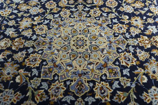 Central medallion detail of 2000s Kashan rug from Iran / Persia