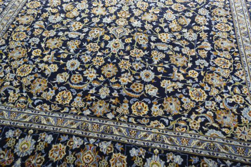 Close-up detail of 2000s Kashan rug from Iran / Persia showing Wool weave
