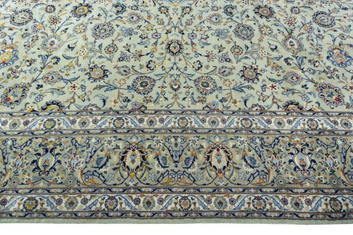 Corner detail of 2000s Kashan rug showing border pattern and Wool pile