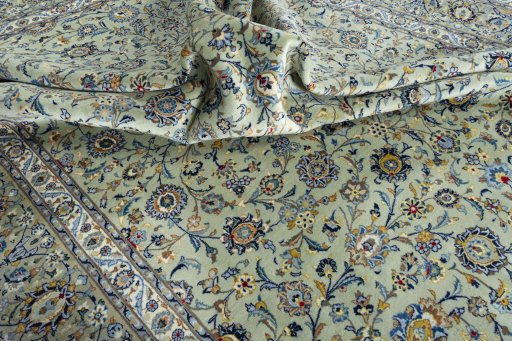 Surface texture of 2000s Kashan rug with natural Wool and intricate pattern