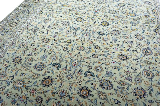 Backside of handmade 2000s Kashan rug showing knot structure and weave density