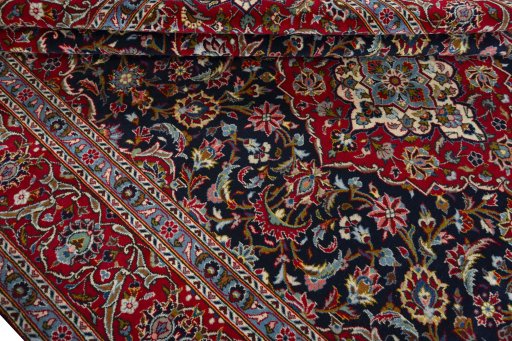 Close-up detail of 2000s Kashan rug from Iran / Persia showing Wool weave