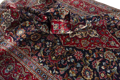 Surface texture of 2000s Kashan rug with natural Wool and intricate pattern