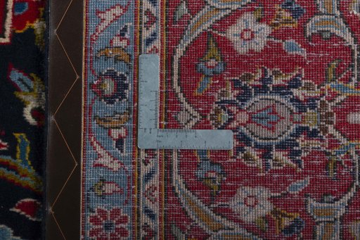 Backside of handmade 2000s Kashan rug showing knot structure and weave density