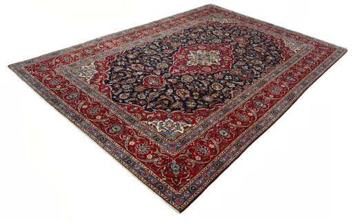 Corner detail of 2000s Kashan rug showing border pattern and Wool pile