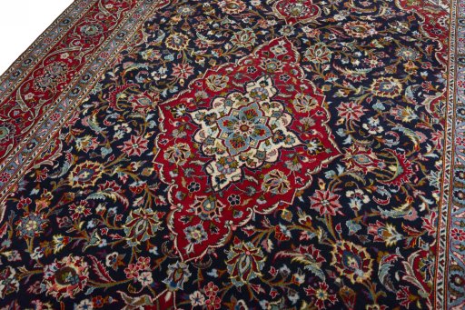 Backside of handmade 2000s Kashan rug showing knot structure and weave density