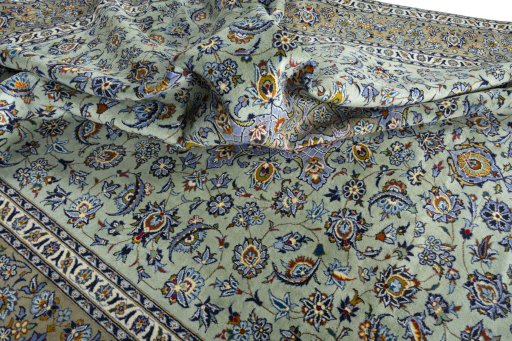 Surface texture of 2000s Kashan rug with natural Wool and intricate pattern