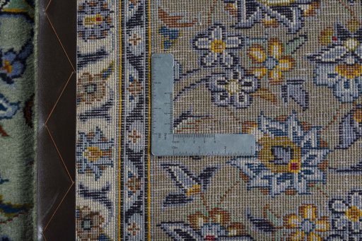 Backside of handmade 2000s Kashan rug showing knot structure and weave density