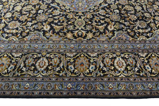 Corner detail of 2000s Kashan rug showing border pattern and Wool pile