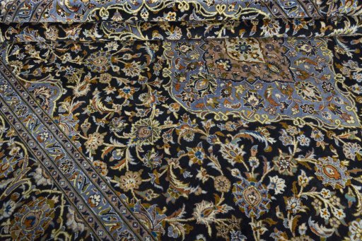 Close-up detail of 2000s Kashan rug from Iran / Persia showing Wool weave