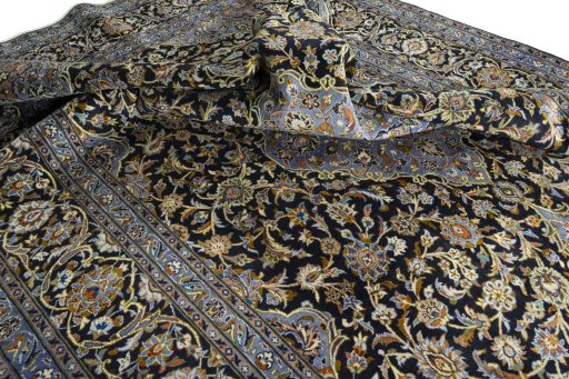 Surface texture of 2000s Kashan rug with natural Wool and intricate pattern