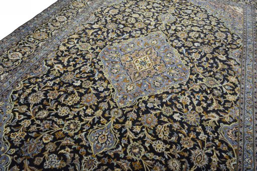 Backside of handmade 2000s Kashan rug showing knot structure and weave density