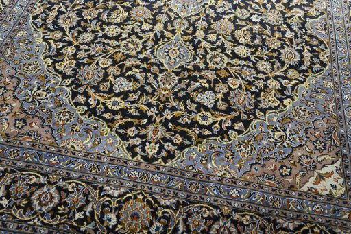Close-up detail of 2000s Kashan rug from Iran / Persia showing Wool weave