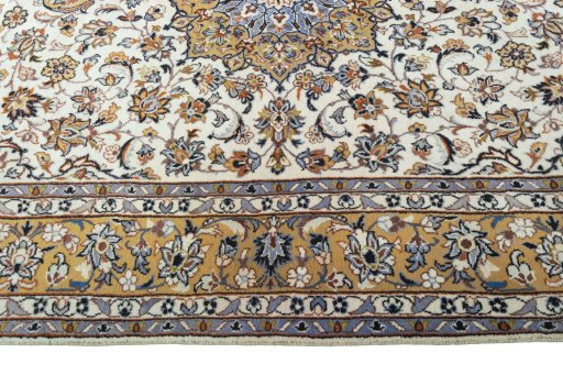 Corner detail of 2000s Kashan rug showing border pattern and Wool pile