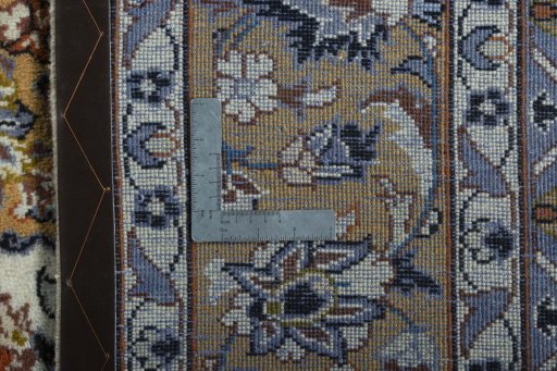 Backside of handmade 2000s Kashan rug showing knot structure and weave density