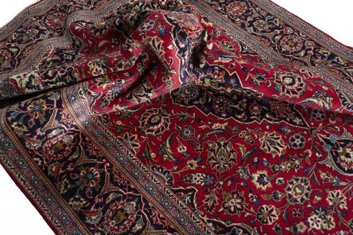 Surface texture of 2000s Kashan rug with natural Wool and intricate pattern