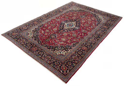 Corner detail of 2000s Kashan rug showing border pattern and Wool pile