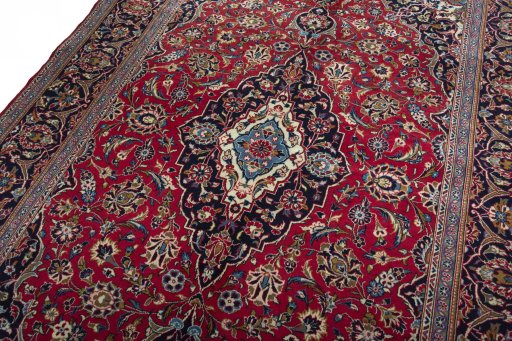 Backside of handmade 2000s Kashan rug showing knot structure and weave density
