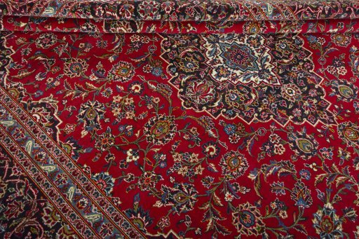 Close-up detail of 2000s Kashan rug from Iran / Persia showing Wool weave