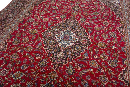 Backside of handmade 2000s Kashan rug showing knot structure and weave density