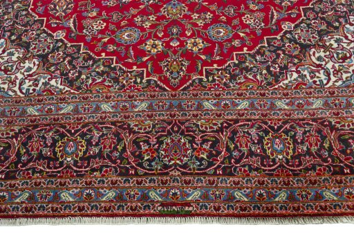 Full view of 2000s Kashan rug from Iran / Persia, 390 × 297 cm in Red tones