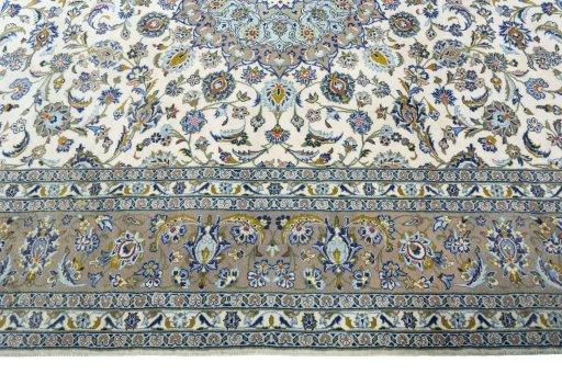 Corner detail of 2000s Kashan rug showing border pattern and Wool pile
