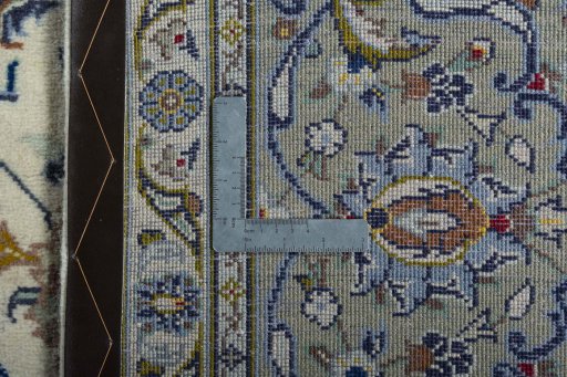 Backside of handmade 2000s Kashan rug showing knot structure and weave density