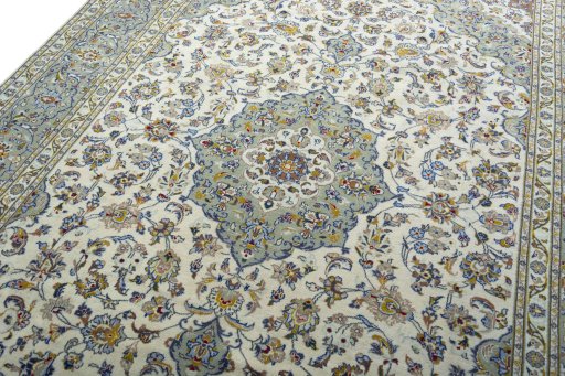 Backside of handmade 2000s Kashan rug showing knot structure and weave density