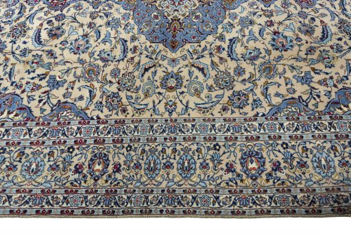 Corner detail of 2000s Kashan rug showing border pattern and Wool pile