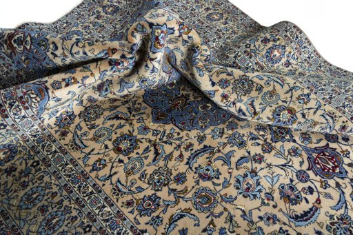 Surface texture of 2000s Kashan rug with natural Wool and intricate pattern