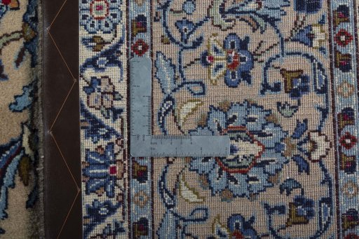 Backside of handmade 2000s Kashan rug showing knot structure and weave density