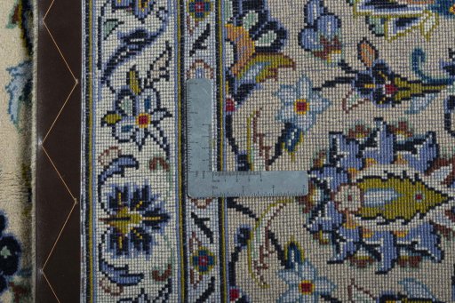Backside of handmade 2000s Kashan rug showing knot structure and weave density