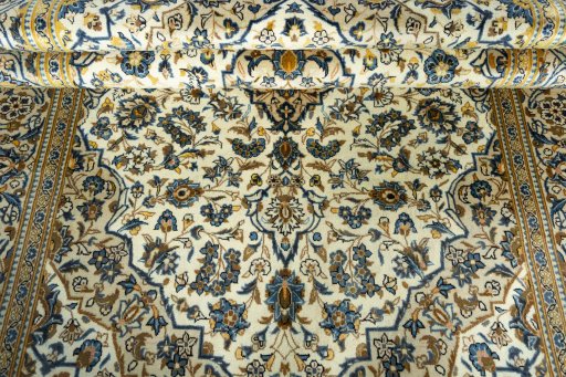 Close-up detail of 2000s Kashan rug from Iran / Persia showing Wool weave