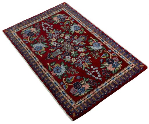 Corner detail of New Kashan rug showing border pattern and Cork pile