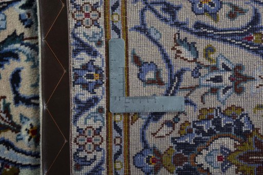 Backside of handmade 2000s Kashan rug showing knot structure and weave density